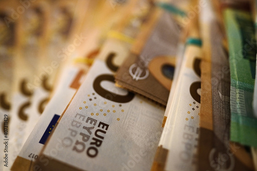 Bundled euro banknotes with selective focus photo