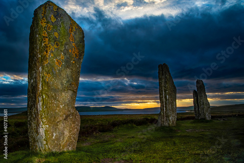 Menhirs on the site of Ring of Brodgar in Scotland photo