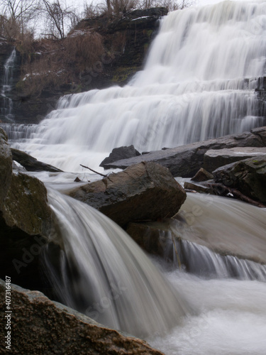 Long exposure capture with a focus on the small waterfall and rocks at the bottom left of the image.