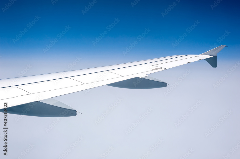 View from airborne airplane window at cloudy milky sky at high altitude. View from airborne airplane window at cloudy milky sky at high altitude.