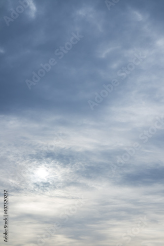 Beautiful gray sky over horizon. Sun through stormy clouds.