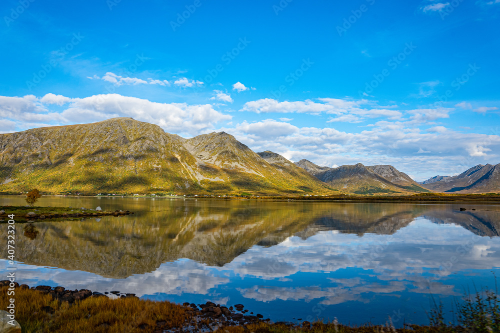 Reflections from mountains in a fjord in Norway