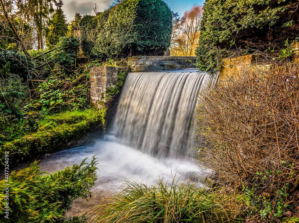 A long exposure view across a waterfall at Newstead Park ...