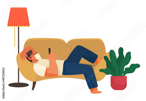 The man lies on the couch at home and correspondence surfing the Internet. Male character communicating through network on the smartphone. Social media network communication digital gadget addiction