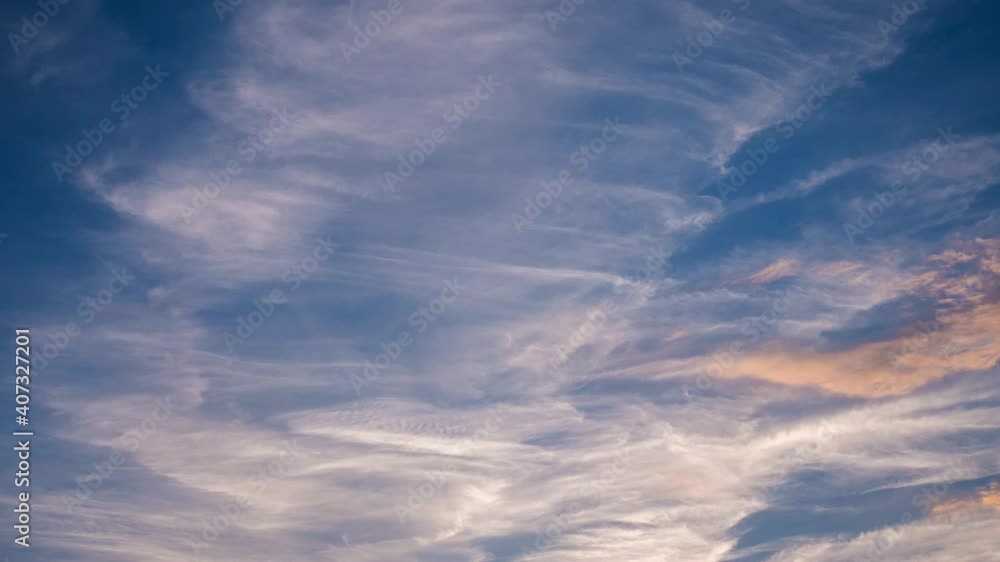 Fast moving sunset clouds time lapse video in the evening when the sun is going down and emitting colorful light Fast moving sunset clouds time lapse video in the evening when the sun is going down and emitting colorful light
