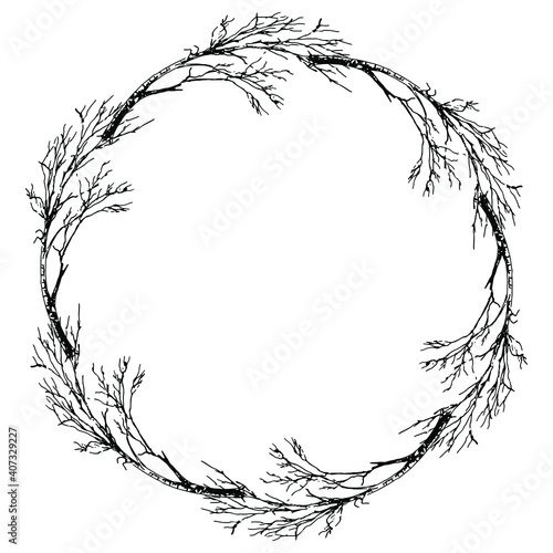 Round floral frame with silhouettes of bare trees or branches. Hand drawn sketch.
