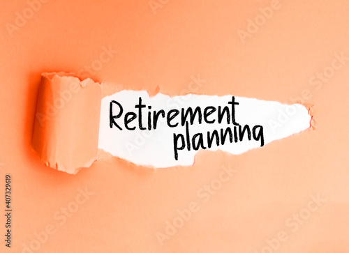 Phrase retirement planning in English, written on a torn paper.