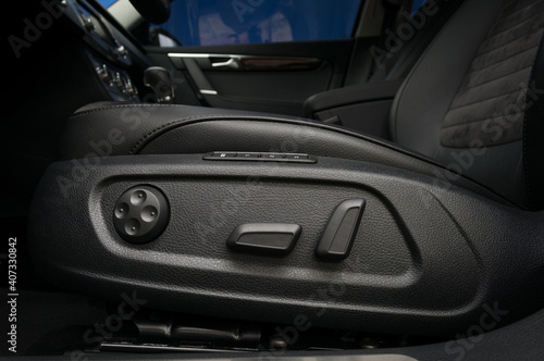 Car interior detail. Buttons for adjusting seat position.