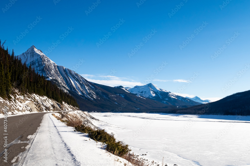 Winter view of a road along Medicine Lake within Jasper National Park, Canada