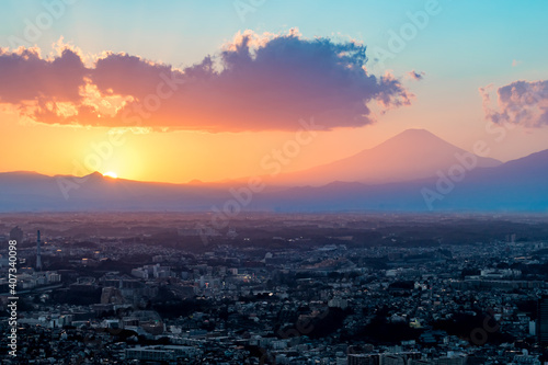 Sunset behind Mt Fuji in Yokohama Japan with Tokyo city below.