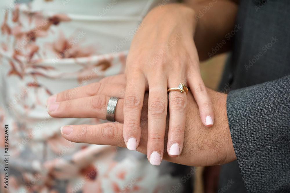 Wedding rings with newly weds hands Wedding rings with newly weds hands