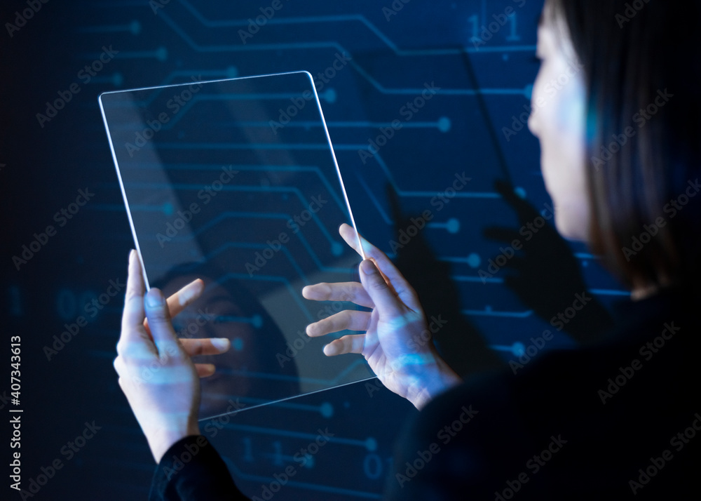 Fototapeta premium Businessman holding transparent tablet innovative future technology