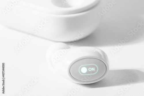 White wireless earbuds with case