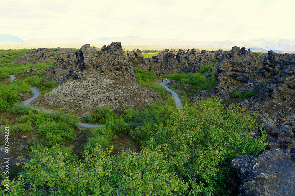 The walking trail along the unique rock structure at Dimmuborgir Lava Formations near Lake Myvatn, Iceland in the summer