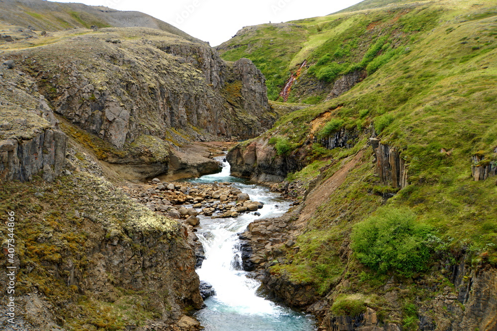 The view of a remote waterfalls off Route 1 near Jokuldalur, Iceland during the summer The view of a remote waterfalls off Route 1 near Jokuldalur, Iceland during the summer