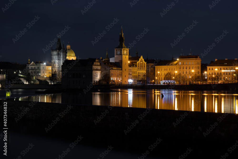 .Vltava river near Charles bridge at night in January 2021