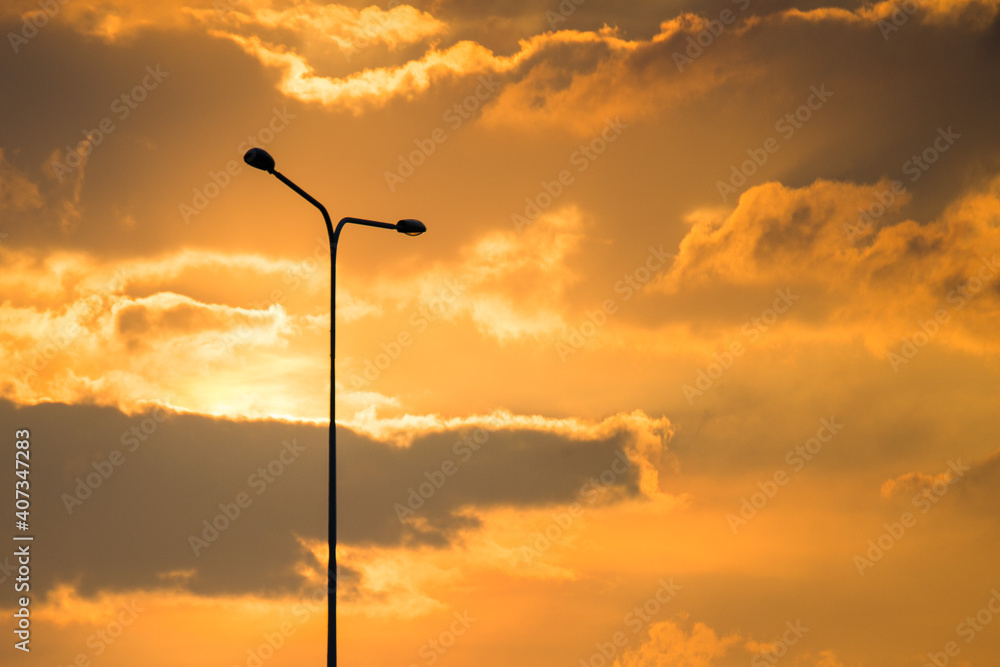 Street lamp on evening Golden sky and clouds background  and copy space