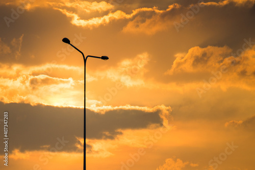 Street lamp on evening Golden sky and clouds background and copy space