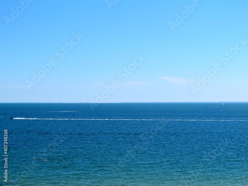 blue sea and sky have boat moving on sea