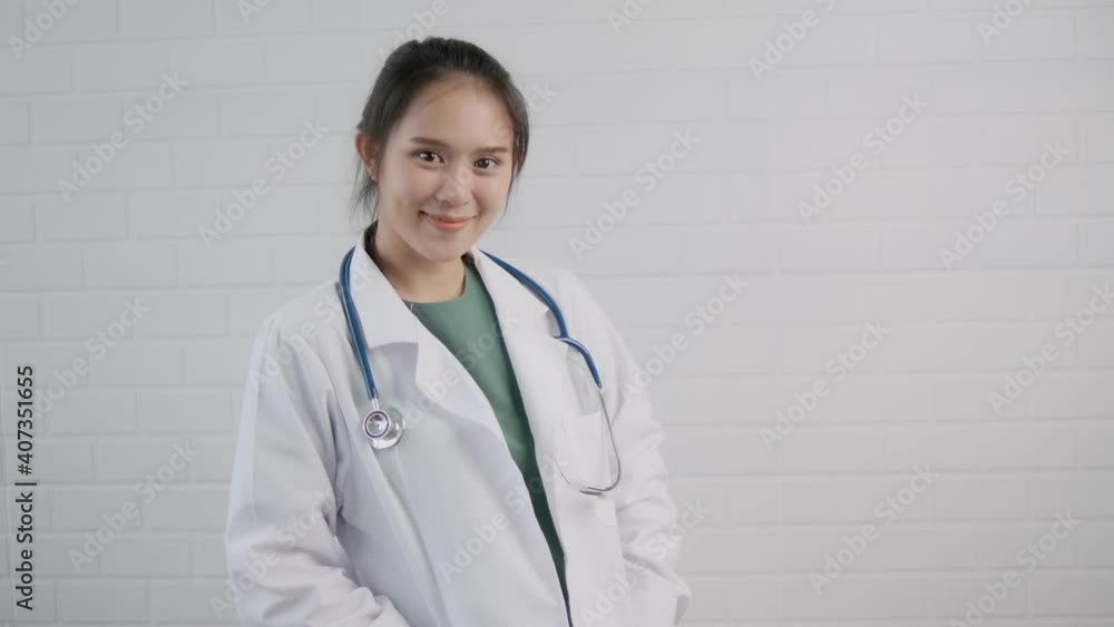 Happy friendly attractive Asian doctor surgeon smiling strong confident arms crossed professional specialist medical healthcare safety protection coronavirus covid-19 pandemic white background. Happy friendly attractive Asian doctor surgeon smiling strong confident arms crossed professional specialist medical healthcare safety protection coronavirus covid-19 pandemic white background.