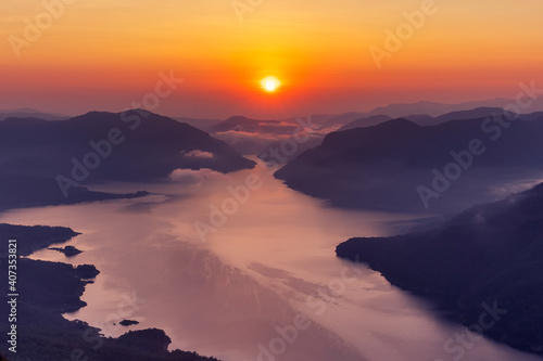 Beautiful Aerial view sunrise over the mountain range at the north of thailand, Beauty rainforest landscape with fog in morning on mountain pha daeng luang, Mae Ping National Park.