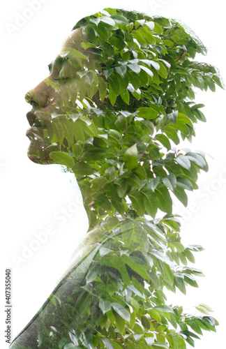 A double exposure portrait young woman profile with her eyes closed against white background and tree leaves