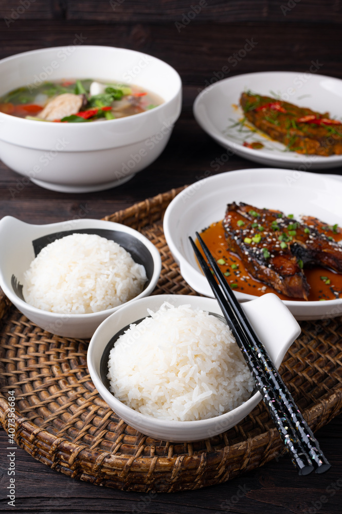 Bowl of boiled rice served on wooden table, Bowl of boiled rice served on wooden table,