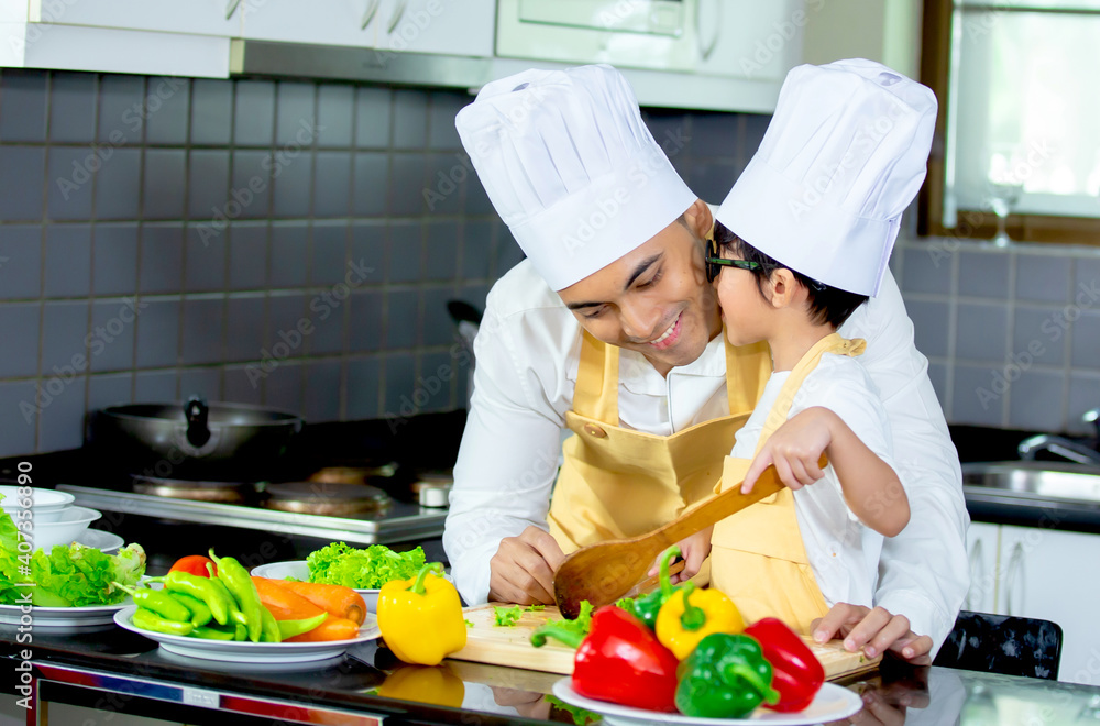 Happy family Asian man young father with son boy cooking healthy salad for the first time. first lesson and healthy lifestyle concept. Happy family Asian man young father with son boy cooking healthy salad for the first time. first lesson and healthy lifestyle concept.