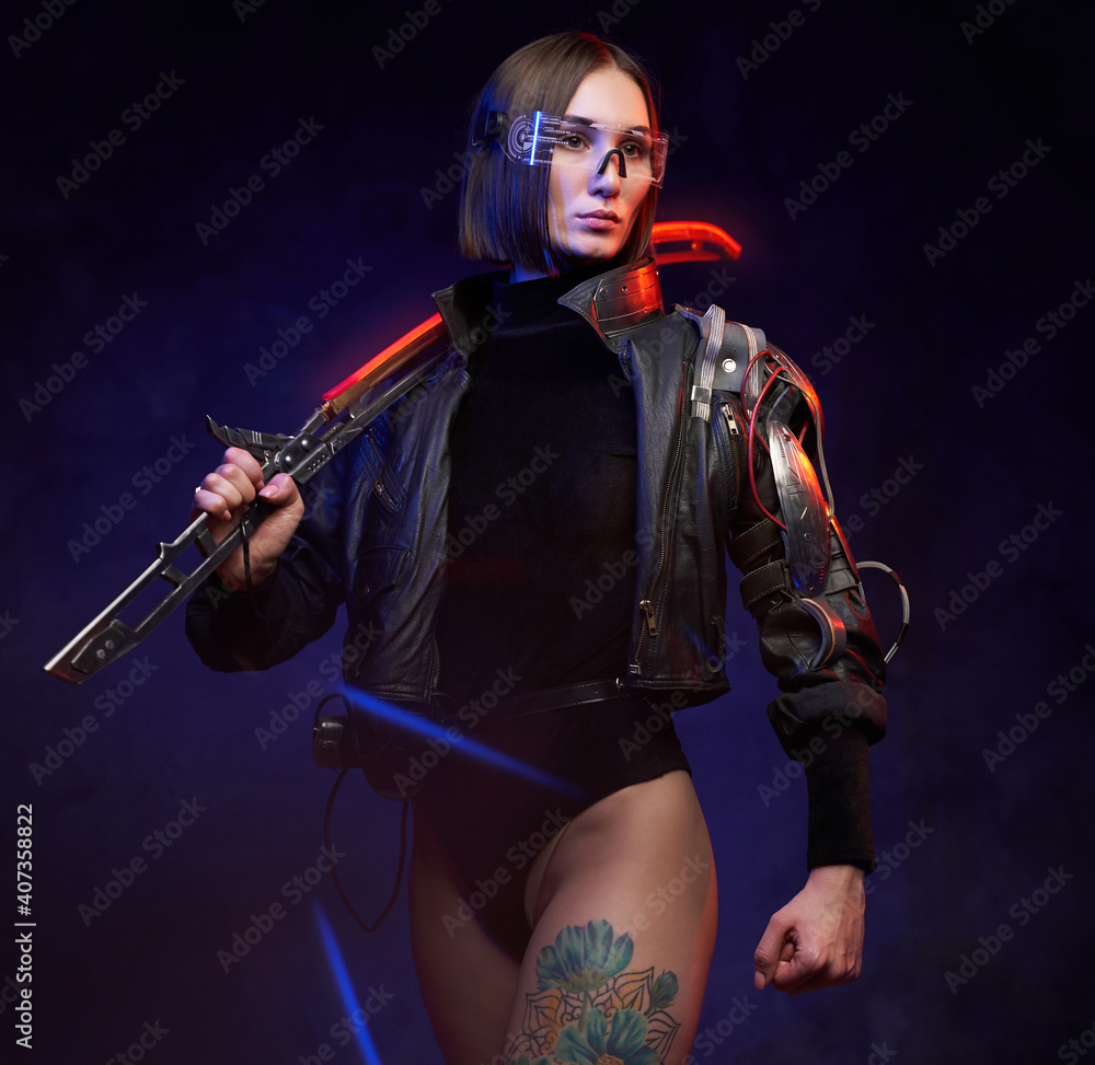 Stylish and at the same time dangerous woman assassin from future with glowing sword. Female soldier in cyberpunk style with implant and glasses.