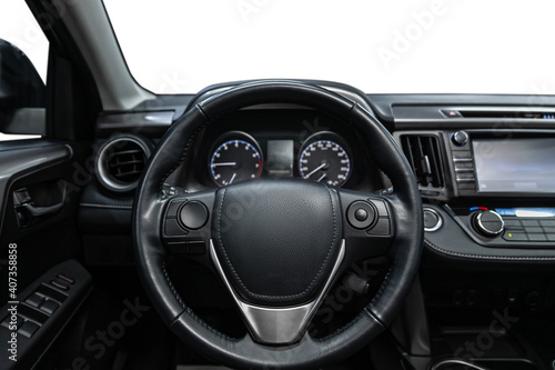 car Interior - steering wheel, shift lever and dashboard, climate control, speedometer, display  on white isolated background. © Виталий Сова
