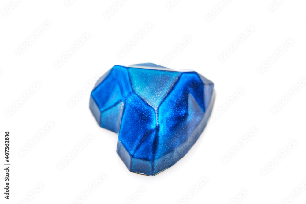Chocolates in the form of precious stones - sapphire in the shape of a heart on a white background. Gift for St. Valentine Chocolates in the form of precious stones - sapphire in the shape of a heart on a white background. Gift for St. Valentine