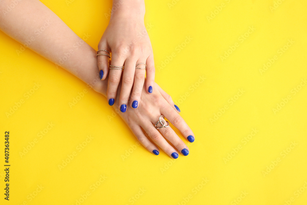 Fototapeta premium Hands with beautiful manicure on color background