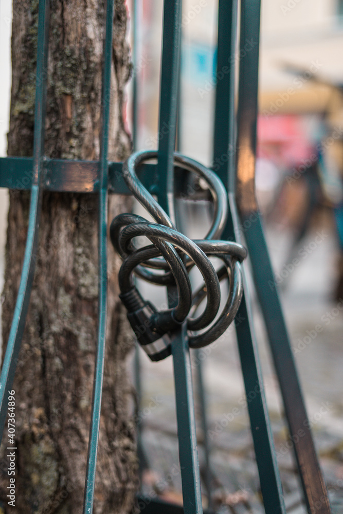 rusty metal fence with bycicle lock