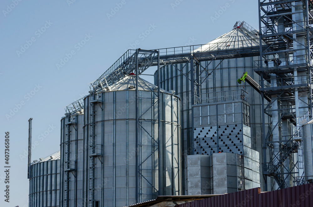 Cylinder silos for wheat, corn, barley and other grain crops. Industry, agribusiness. Cylinder silos for wheat, corn, barley and other grain crops. Industry, agribusiness.