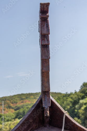Wooden bow of a boat in the river