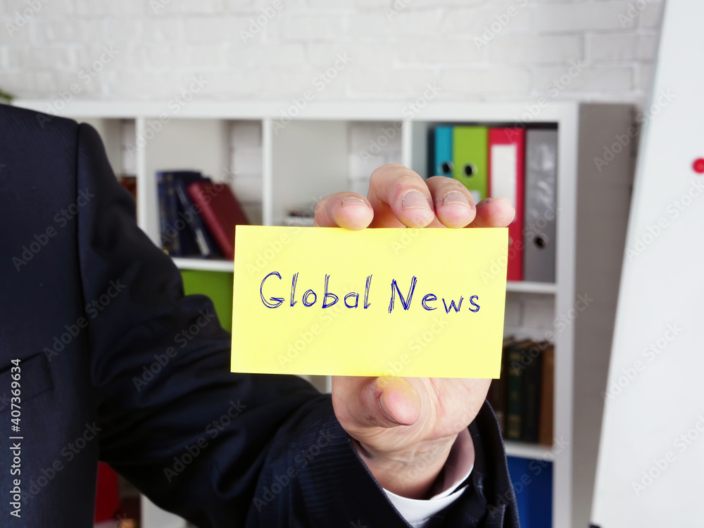 Business concept meaning Global News with sign on the piece of paper. Business concept meaning Global News with sign on the piece of paper.