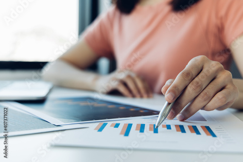 Accounting businesswomen are calculating income-expenditure and analyzing real estate investment data, Dedicated to the progress and growth of the company, Financial and tax systems concept.