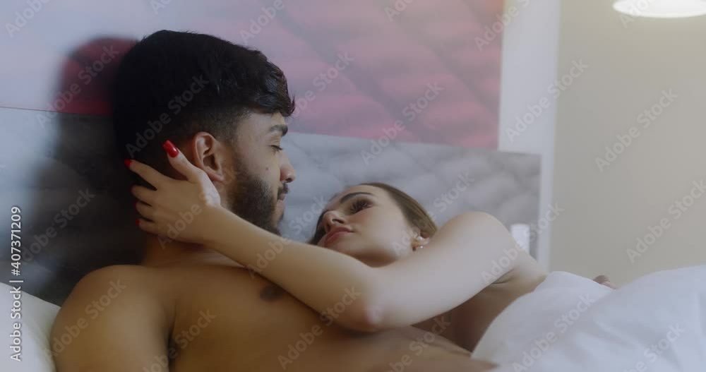 Young loving latin couple in the bed. 4K. Young loving latin couple in the bed. 4K.