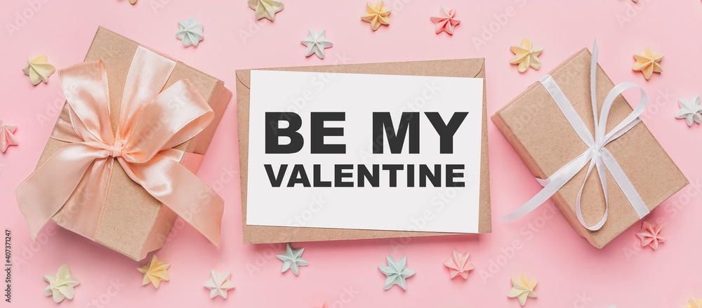Gifts with note letter on isolated pink background with sweets, love and valentine concept with text be my Valentine Gifts with note letter on isolated pink background with sweets, love and valentine concept with text be my Valentine