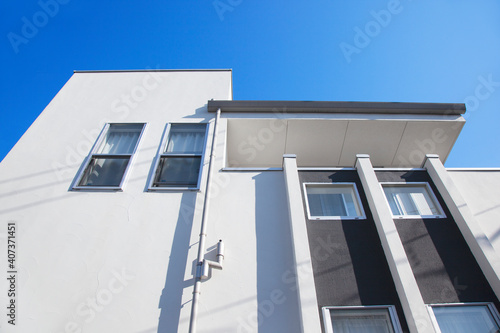 Urban architecture. Close up of a modern house  with blue sky.