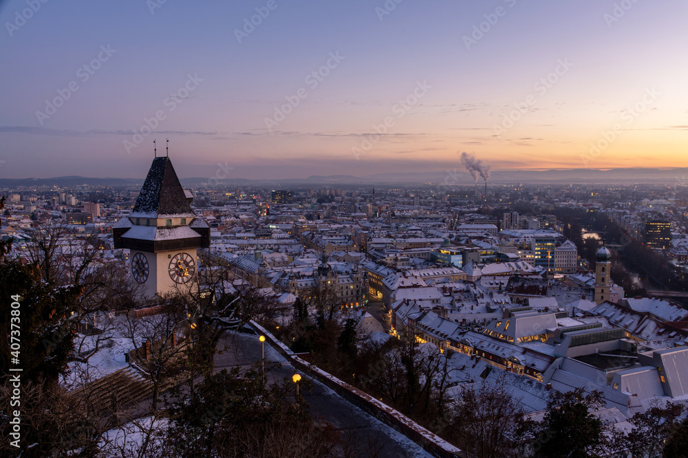 Naklejka premium Graz, Austria - January 11, 2021: Sunset in the winter