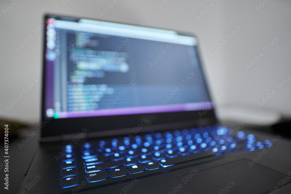 Closeup of a laptop with programming code Closeup of a laptop with programming code