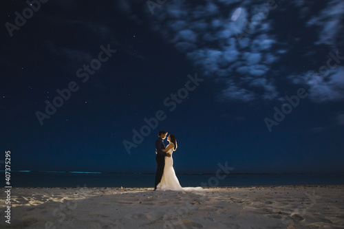 The bride and groom. Starry sky. Drawing light.