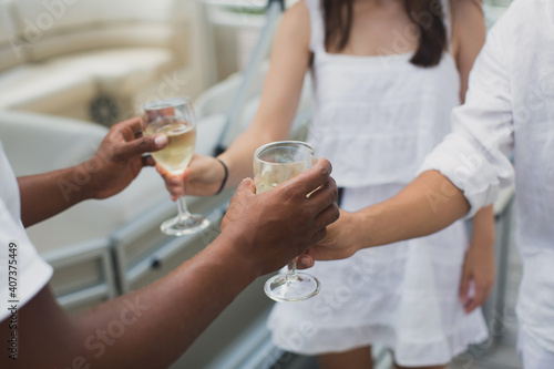 Photography Yacht captain treats his guests to a glass of champagne
