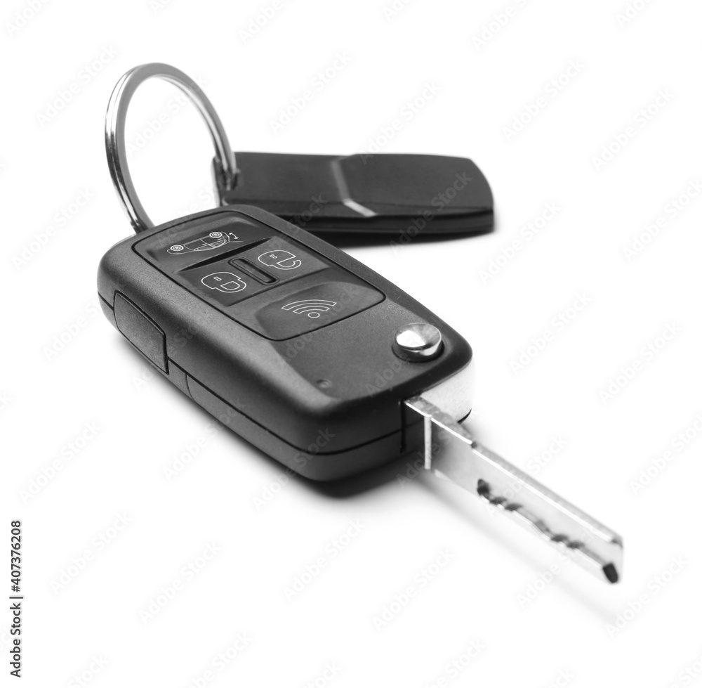 Modern car flip key with trinket isolated on white Modern car flip key with trinket isolated on white