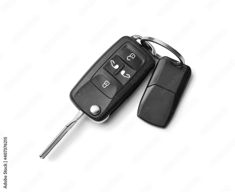 Modern car flip key with trinket isolated on white, top view Modern car flip key with trinket isolated on white, top view