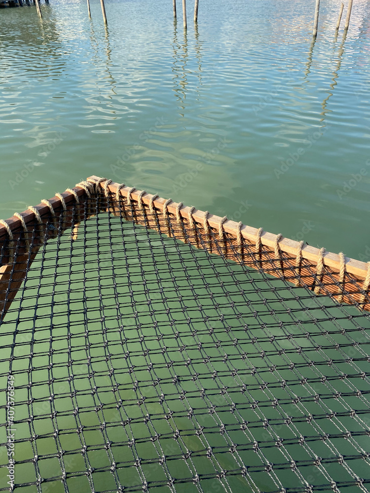 Pier net on the water. Stock Photo