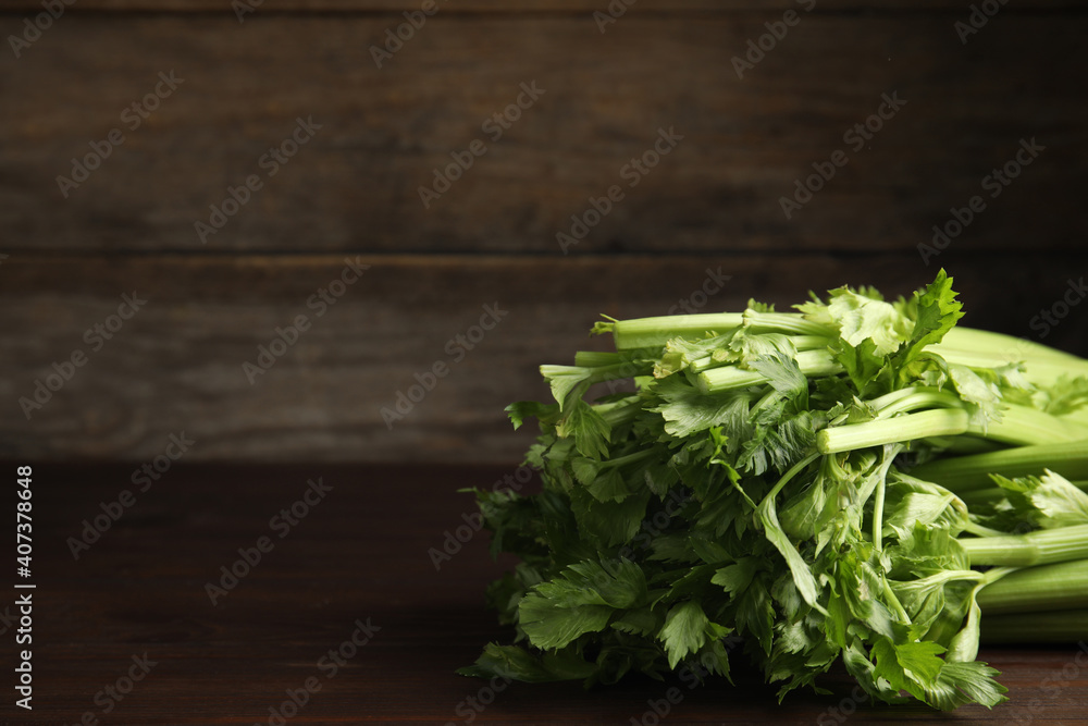 Fresh ripe green celery on wooden table. Space for text Fresh ripe green celery on wooden table. Space for text