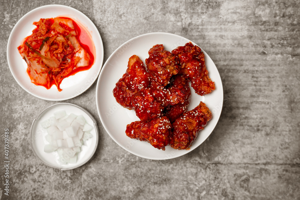 Top view Korean spicy fried chicken with side dishes. Top view Korean spicy fried chicken with side dishes.