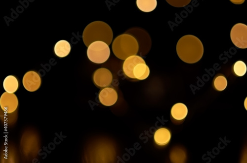 blurry yellow round lights on a dark background